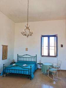 Postel nebo postele na pokoji v ubytování Palazzo Caracciolo