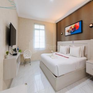 TV a/nebo společenská místnost v ubytování Hotel 78 Parapat Mitra RedDoorz