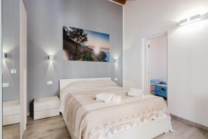 Posteľ alebo postele v izbe v ubytovaní Costa del Golfo