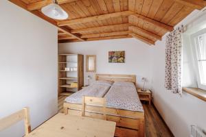 Postel nebo postele na pokoji v ubytování Resort Vysoká Lípa