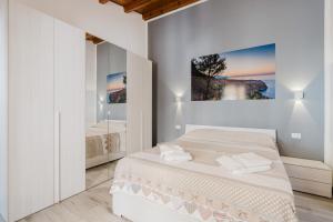 Posteľ alebo postele v izbe v ubytovaní Costa del Golfo