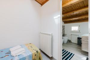 Posteľ alebo postele v izbe v ubytovaní Costa del Golfo