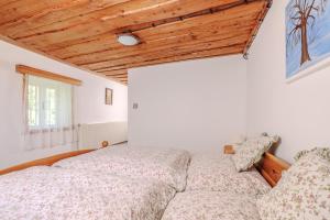 Postel nebo postele na pokoji v ubytování Resort Vysoká Lípa