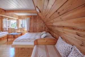 Postel nebo postele na pokoji v ubytování Resort Vysoká Lípa