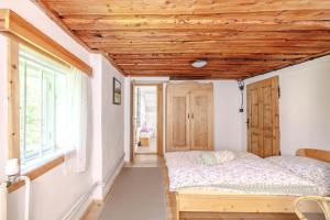 Postel nebo postele na pokoji v ubytování Resort Vysoká Lípa