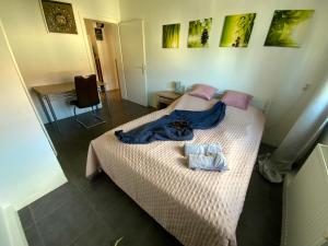 a bedroom with two beds with towels on it at Luminous apartment in Kehl near Strasbourg, conveniently located next to a tram stop with direct access to Strasbourg city centre in Kehl am Rhein