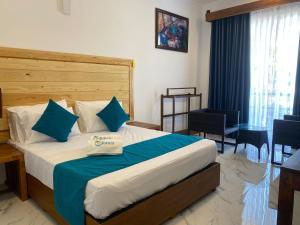 Ένα ή περισσότερα κρεβάτια σε δωμάτιο στο Trinco Beach Resort