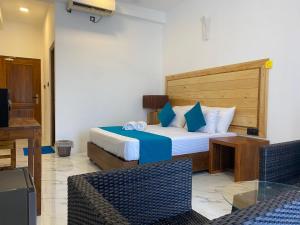Ένα ή περισσότερα κρεβάτια σε δωμάτιο στο Trinco Beach Resort