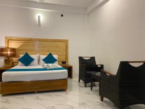 Ένα ή περισσότερα κρεβάτια σε δωμάτιο στο Trinco Beach Resort