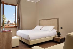 Letto o letti in una camera di Essence Hotel