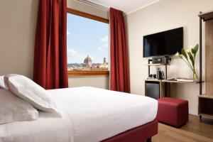 TV o dispositivi per l'intrattenimento presso Essence Hotel