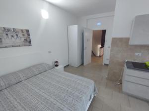 a bedroom with a bed and a sink in it at Affittacamere dragone in Cimitile