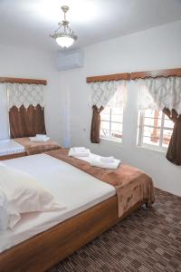 Postel nebo postele na pokoji v ubytování Guesthouse Gogu