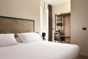 Letto o letti in una camera di Essence Hotel