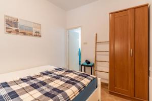 Postel nebo postele na pokoji v ubytování Apartman GREEN & BLUE