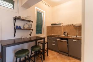 Kuchyň nebo kuchyňský kout v ubytování Apartman GREEN & BLUE