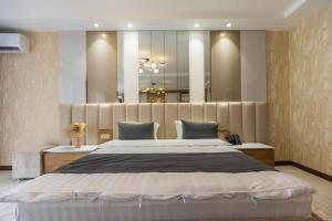 Voodi või voodid majutusasutuse Firdavsi Hotel toas