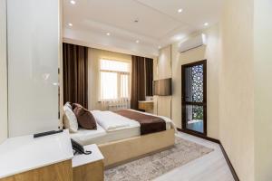 Voodi või voodid majutusasutuse Firdavsi Hotel toas