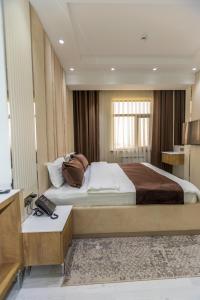 Voodi või voodid majutusasutuse Firdavsi Hotel toas