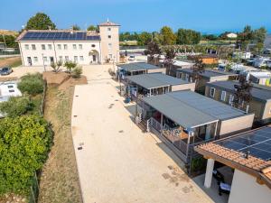 an overhead view of a building with solar panels on it at I Campi Wine Relais Mobile Homes in Ronchi
