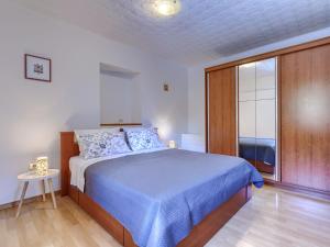 Katil atau katil-katil dalam bilik di Apartment Bumbak by Interhome