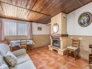 a living room with a couch and a fireplace at Holiday Home Rural Cacin by Interhome in Cacin