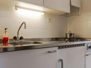 a kitchen with a sink and a counter top at Apartment Valaisia 34A by Interhome in Nendaz