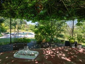 a table with wine glasses on top of it at Holiday Home Carla by Interhome in Cortazzone
