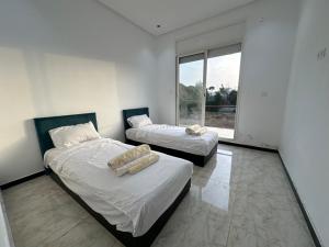 Ένα ή περισσότερα κρεβάτια σε δωμάτιο στο Villa Hay Riad