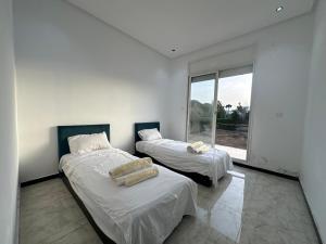 Ένα ή περισσότερα κρεβάτια σε δωμάτιο στο Villa Hay Riad +8 φωτογραφίες