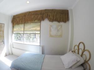 Ein Bett oder Betten in einem Zimmer der Unterkunft Seminyak Beach Tropical Hideaway Apartment