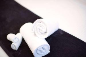 two rolls of toilet paper on a black surface at Sora East Melbourne in Melbourne +68 photos