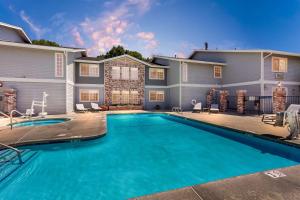 a swimming pool in front of a house at Comfort Inn & Suites Susanville in Susanville
