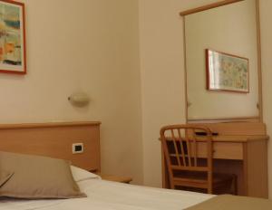 Posteľ alebo postele v izbe v ubytovaní Hotel Astor