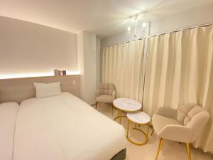 A bed or beds in a room at THE MOON Atami