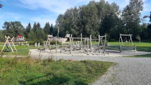 a park with an empty playground with at Ferienhaus Meister Eder in Waldkirchen +2 photos