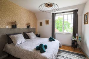 Postel nebo postele na pokoji v ubytování Chalet des longschamps