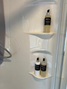 two bottles ofodorizers are sitting in a refrigerator at Ravenswood Pod in Fort William +20 photos
