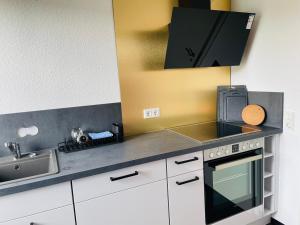 Kuchyň nebo kuchyňský kout v ubytování ROOFTOP RESlDENCE + 16 fotografií