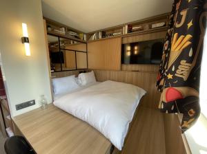 Postel nebo postele na pokoji v ubytování JOST Hôtel Lille Centre