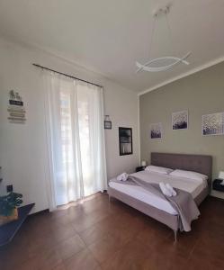 Ένα ή περισσότερα κρεβάτια σε δωμάτιο στο La casa di Pepe - Appartamento centrale luminoso