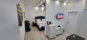 a small room with a bed and a table in it at Bumerang Apartmans, New Belgrade, Belgrade Arena in Belgrade