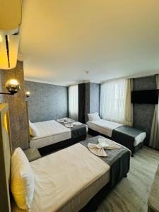 Postel nebo postele na pokoji v ubytování Old City Viva Hotel + 37 fotografií