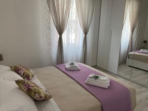 Ένα ή περισσότερα κρεβάτια σε δωμάτιο στο Sweet Home Mariana