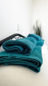 a pile of towels sitting on top of a table at Sea Breeze Apartment in Paphos City