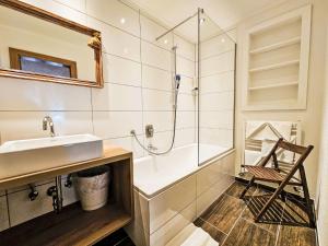 a bathroom with a sink and a shower at Apartment Inn by Interhome in See