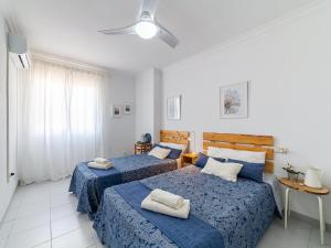 En eller flere senge i et værelse på Apartment Las Terrazas V by Interhome