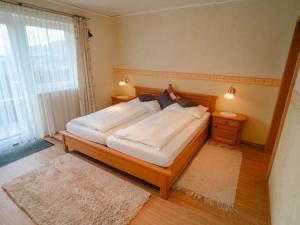 Ένα ή περισσότερα κρεβάτια σε δωμάτιο στο Apartment Kirschbaum by Interhome
