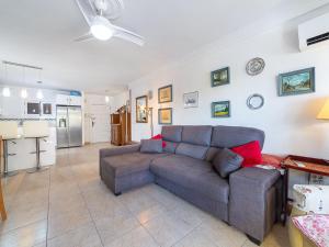 a living room with a couch and a kitchen at Apartment Navio by Interhome in Aguadulce