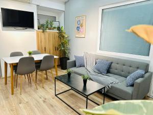 a living room with a couch and a table at Cosy Koala Hostel in Tbilisi City